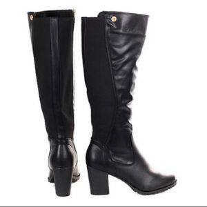 Knee high black heeled boots. Worn once